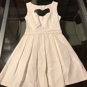 White mini skater dress with heart-back detail